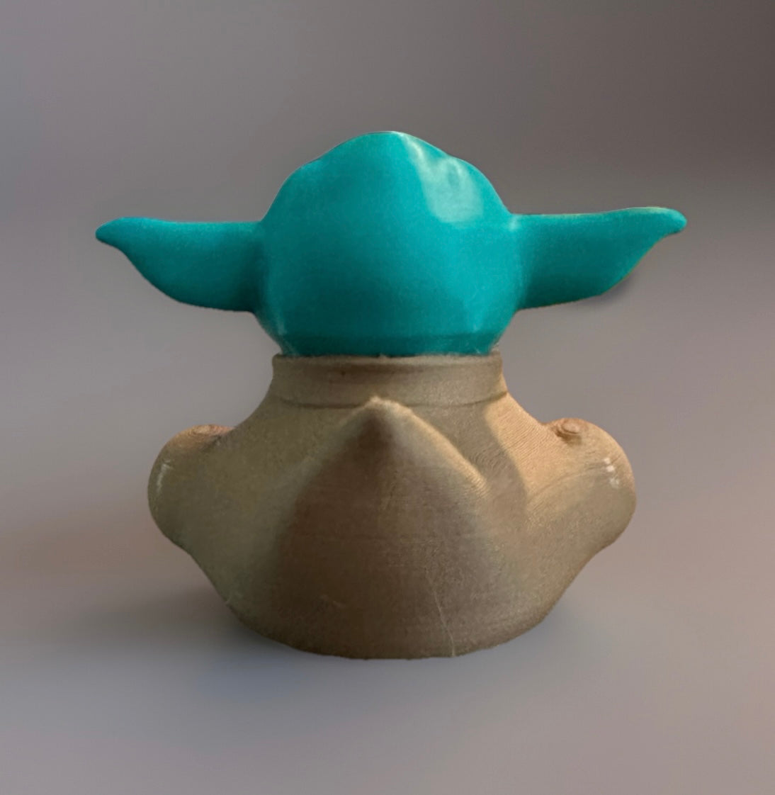 Back view of a 3D printed Yoda duck with green ears and beige robe from Reed’s Rubber Ducks and Sensory Shop