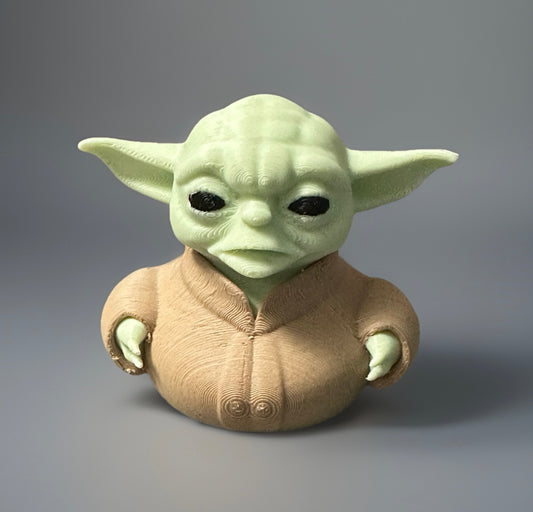 3D printed Yoda duck figurine with green head and beige robe from Reed’s Rubber Ducks and Sensory Shop
