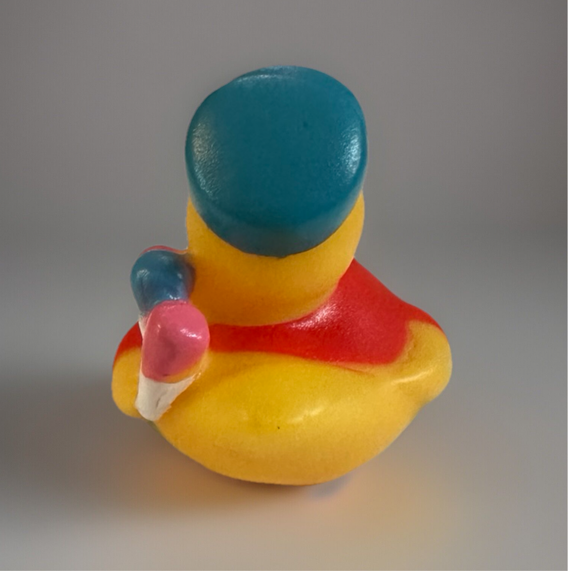 Yellow rubber duck wearing a blue artist hat and holding a paintbrush artist rubber duck gift