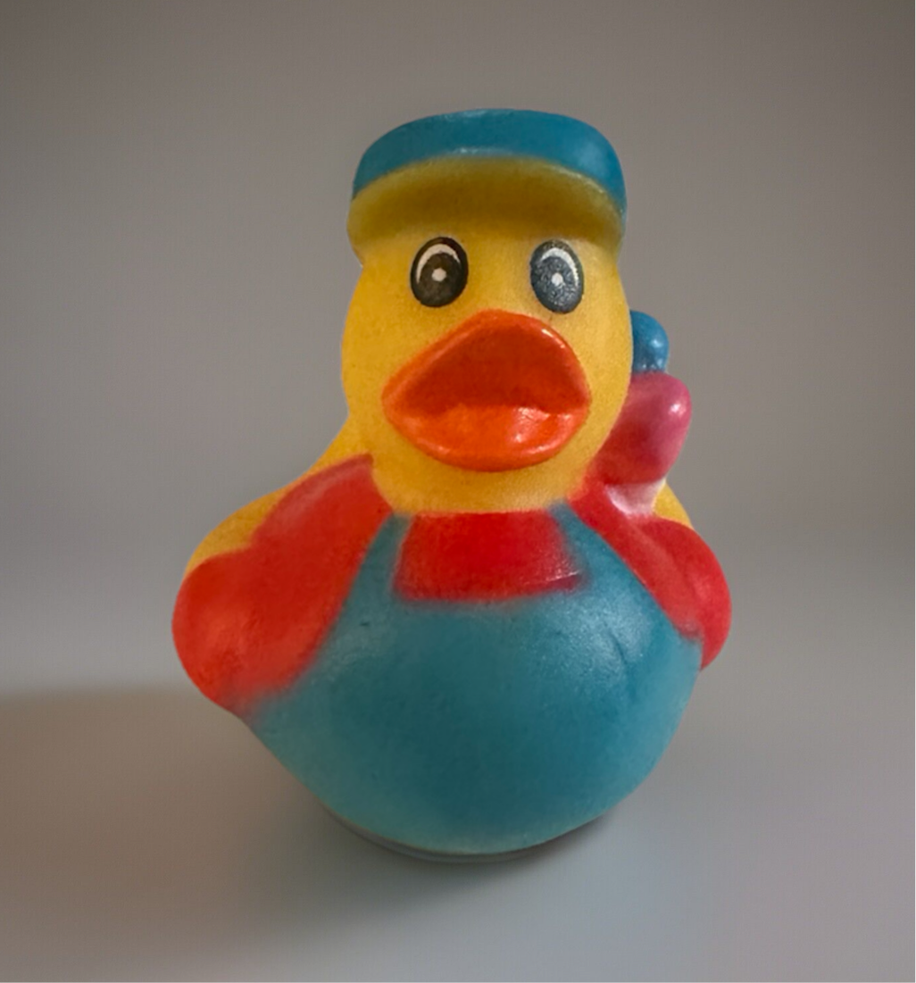 Colorful artist rubber duck gift wearing a blue beret and apron holding a paintbrush