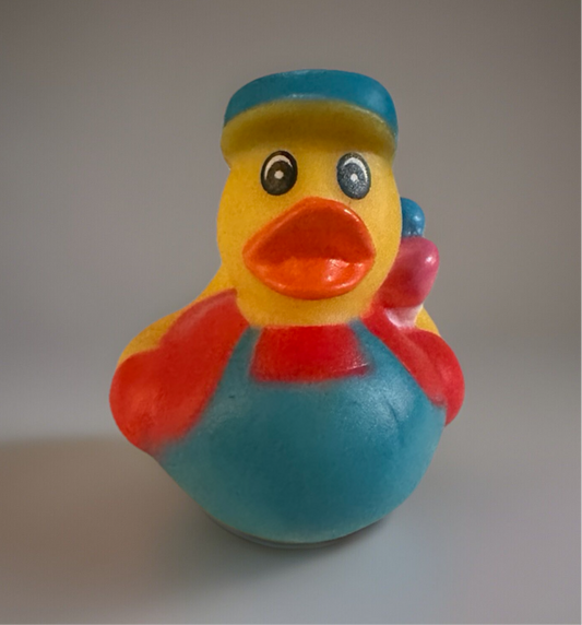 Colorful artist rubber duck gift wearing a blue beret and apron holding a paintbrush