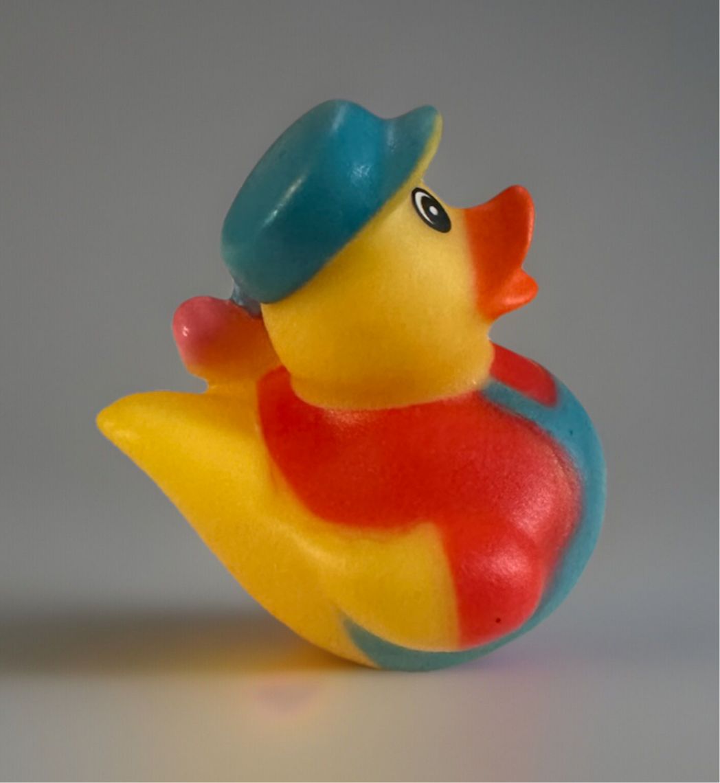 Colorful artist rubber duck gift wearing a blue hat and red outfit by Reed’s Rubber Ducks