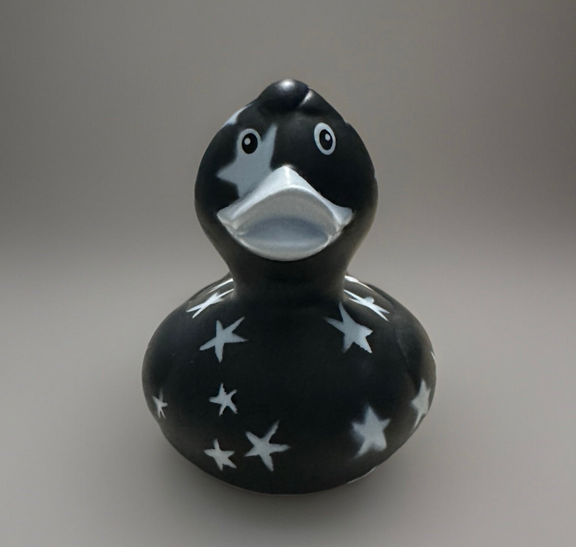 Black star rubber duck with white star patterns and silver beak from Reed’s Rubber Ducks and Sensory Shop