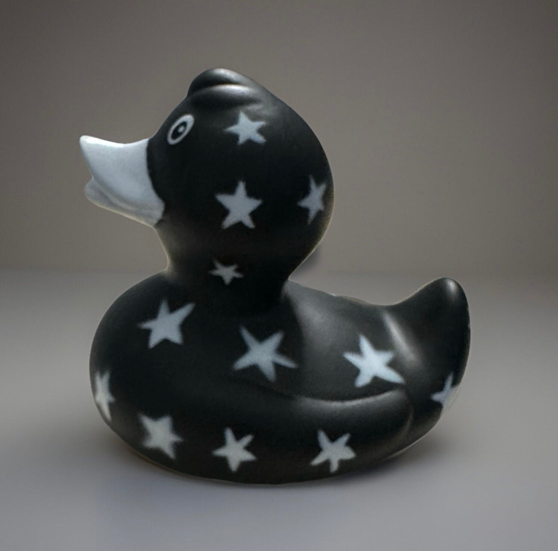 Black star rubber duck with white stars pattern by Reeds Rubber Ducks and Sensory Shop