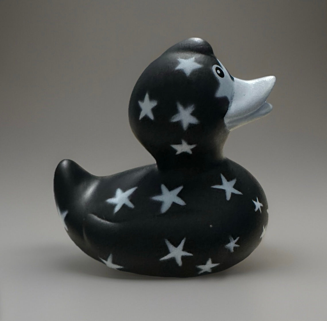 Black star rubber duck with white star patterns from Reed’s Rubber Ducks and Sensory Shop