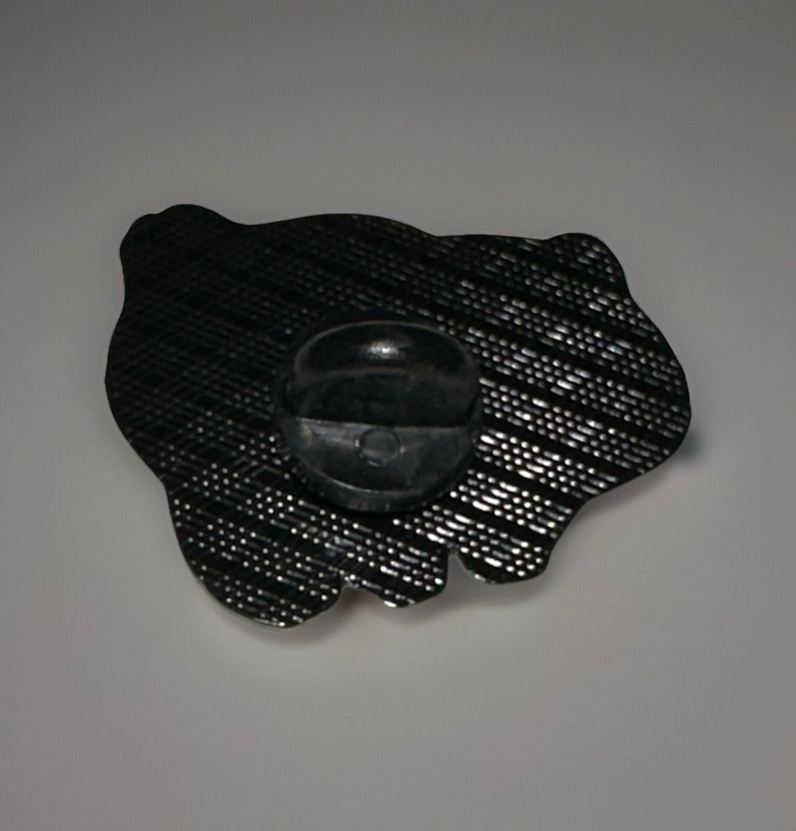 Back view of Bulbasaur enamel pin showing black rubber clutch from Reed’s Rubber Ducks and Sensory Shop