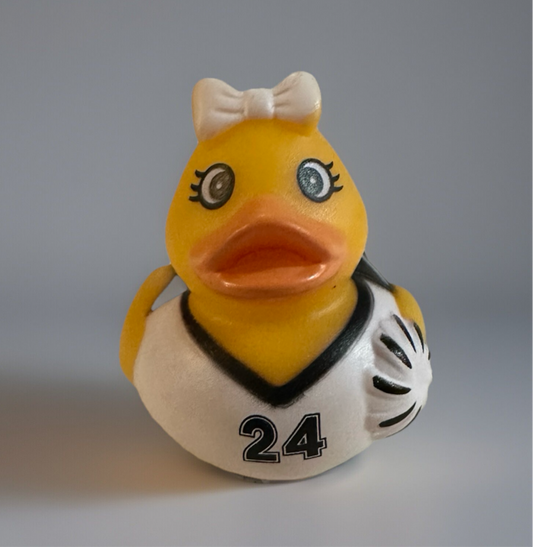 Cheerleader rubber duck toy wearing white cheer uniform with number 24 and a white bow