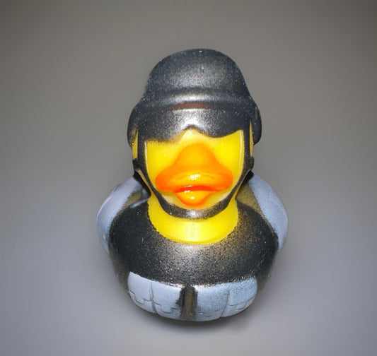 Combat rubber duck wearing black tactical helmet and armor by Reed’s Rubber Ducks and Sensory Shop