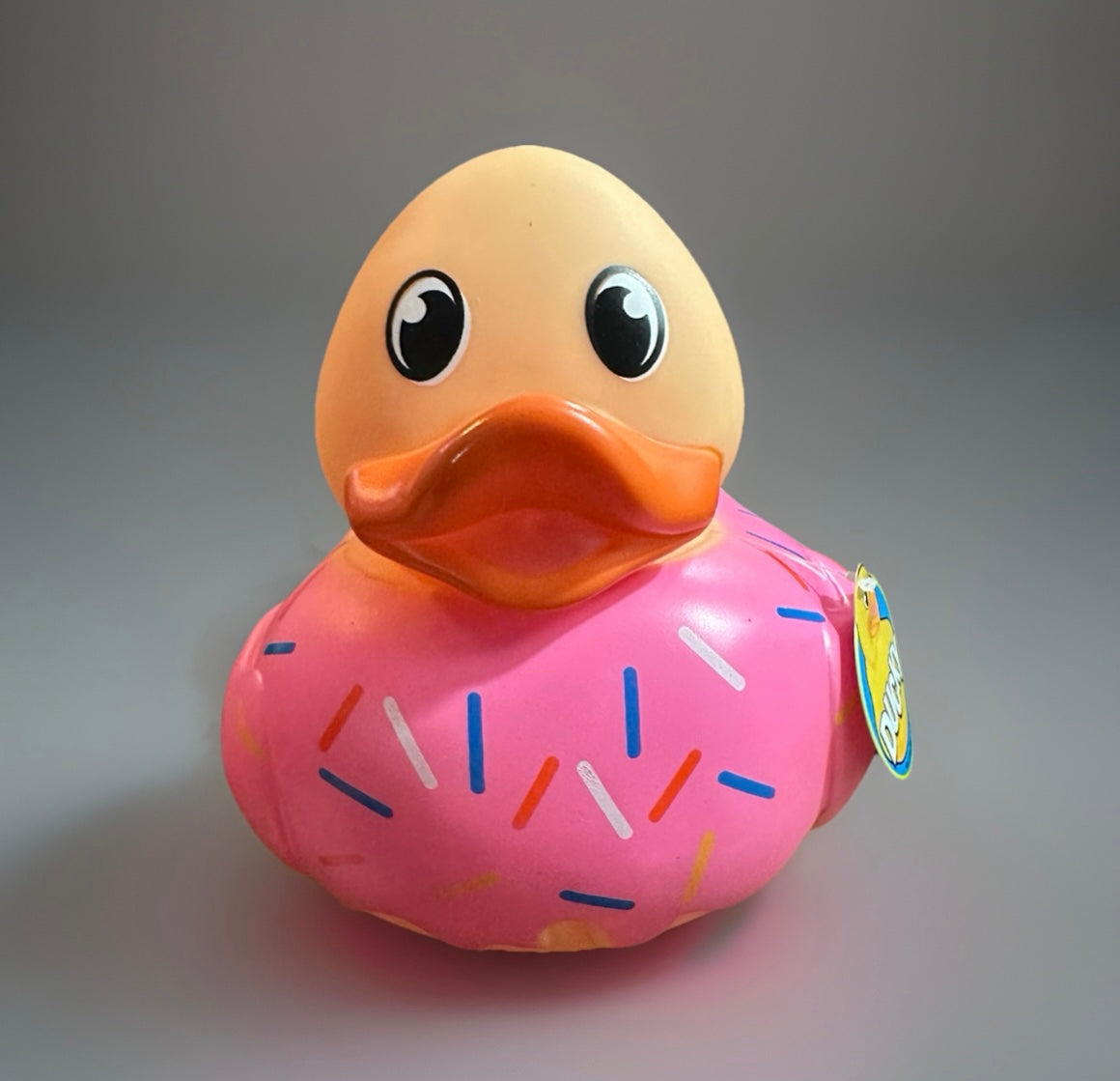 Donut rubber duck with pink frosting and colorful sprinkles from Reed’s Rubber Ducks and Sensory Shop