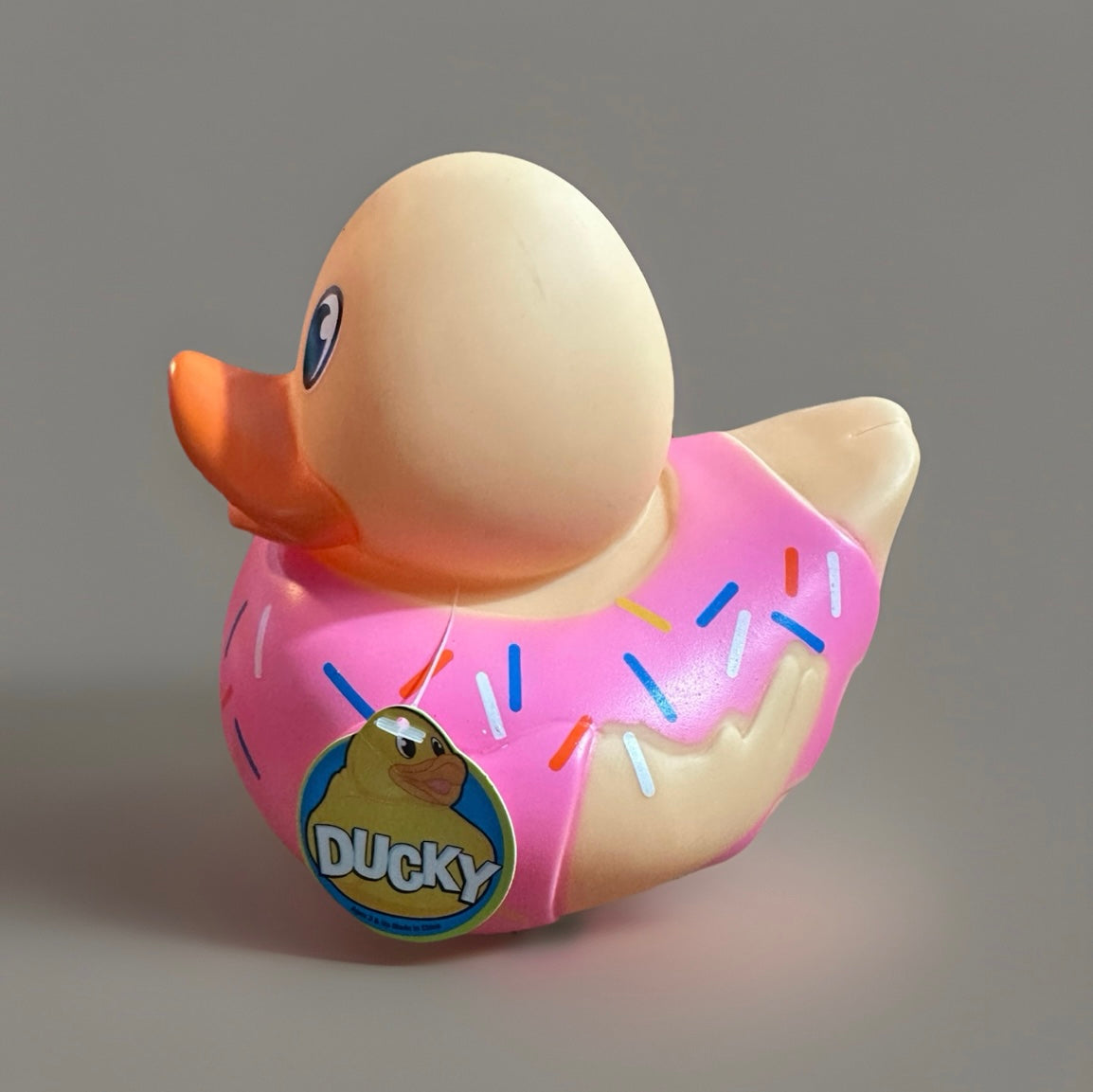 Donut rubber duck with pink icing and colorful sprinkles from Reed’s Rubber Ducks and Sensory Shop