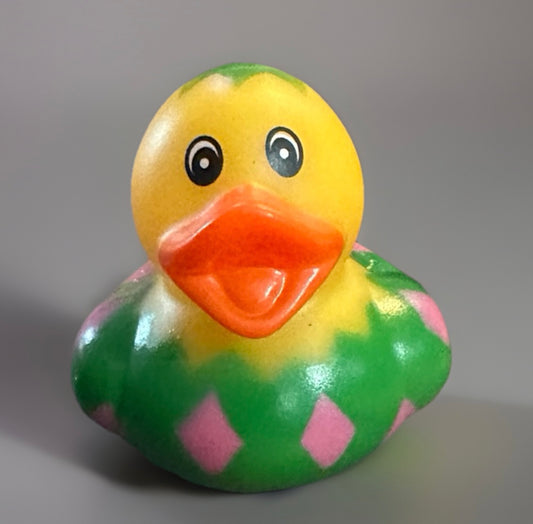 Easter egg rubber duck with yellow head, orange beak, and green body with pink diamond patterns