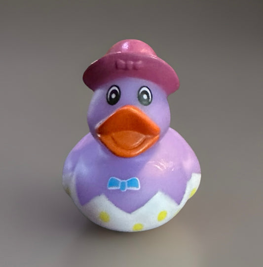 Purple Easter egg rubber duck gift with orange beak, pink hat, and blue bow tie from Reeds Rubber Ducks