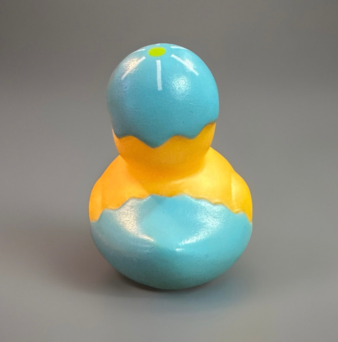 Yellow rubber duck painted as cracked blue and yellow Easter egg for Easter rubber duck gift