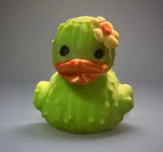 Green 3D printed cactus duck with orange beak and yellow flower from Reeds Rubber Ducks and Sensory Shop