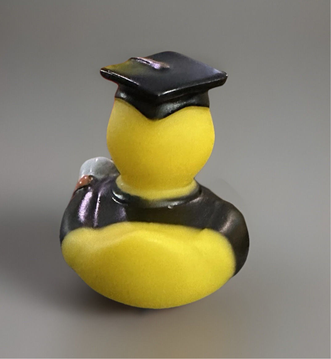 Yellow rubber duck wearing a black graduation cap and gown graduation rubber duck gift