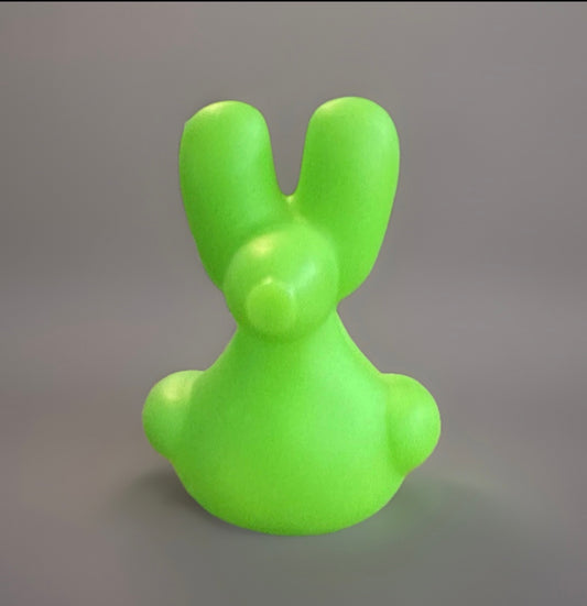 Bright green balloon animal rubber duck with a smooth texture from Reed’s Rubber Ducks and Sensory Shop