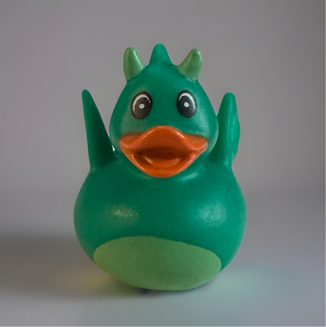 Green Dragon Rubber Duck with horns and orange beak from Reed’s Rubber Ducks and Sensory Shop