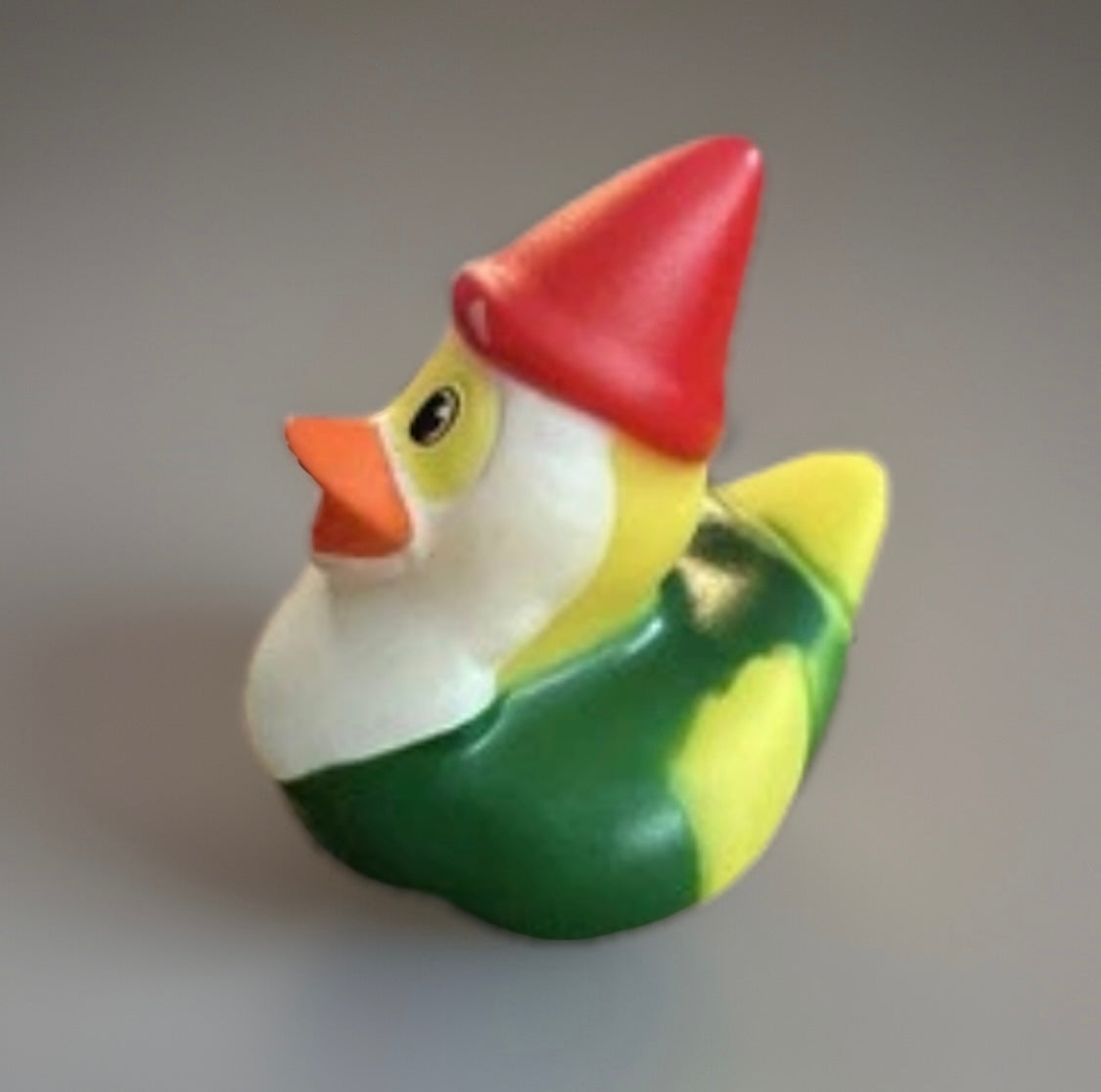 Green gnome rubber duck with red hat and orange beak by Reeds Rubber Ducks and Sensory Shop