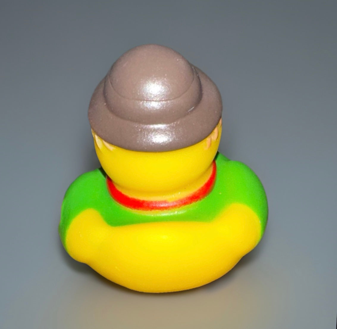 Green scarecrow rubber duck wearing a brown hat and green outfit from Reed’s Rubber Ducks and Sensory Shop