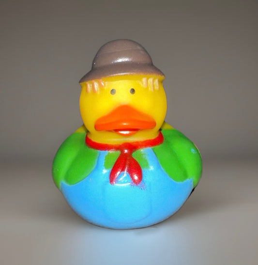 Green scarecrow rubber duck with blue overalls, red neckerchief, and gray hat from Reed’s Rubber Ducks