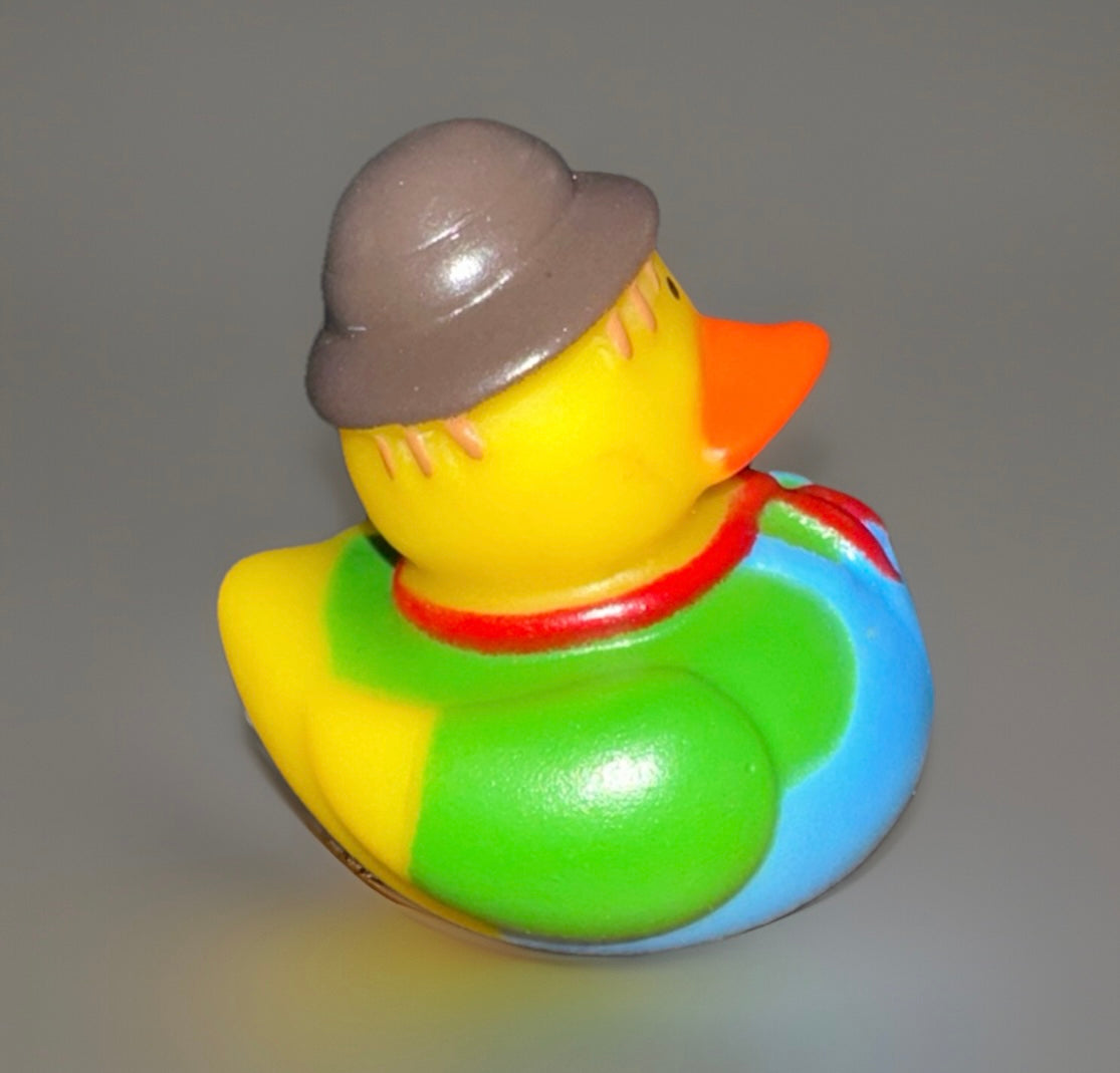 Green scarecrow rubber duck with brown hat and colorful outfit from Reed’s Rubber Ducks and Sensory Shop