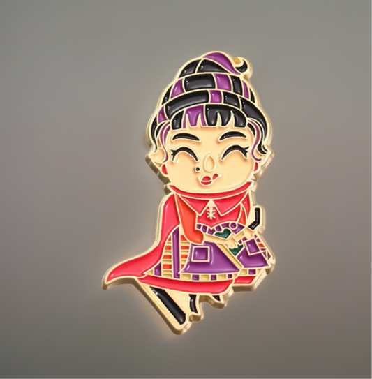 Colorful Hocus Pocus enamel pin featuring a cheerful witch character in purple and red outfit