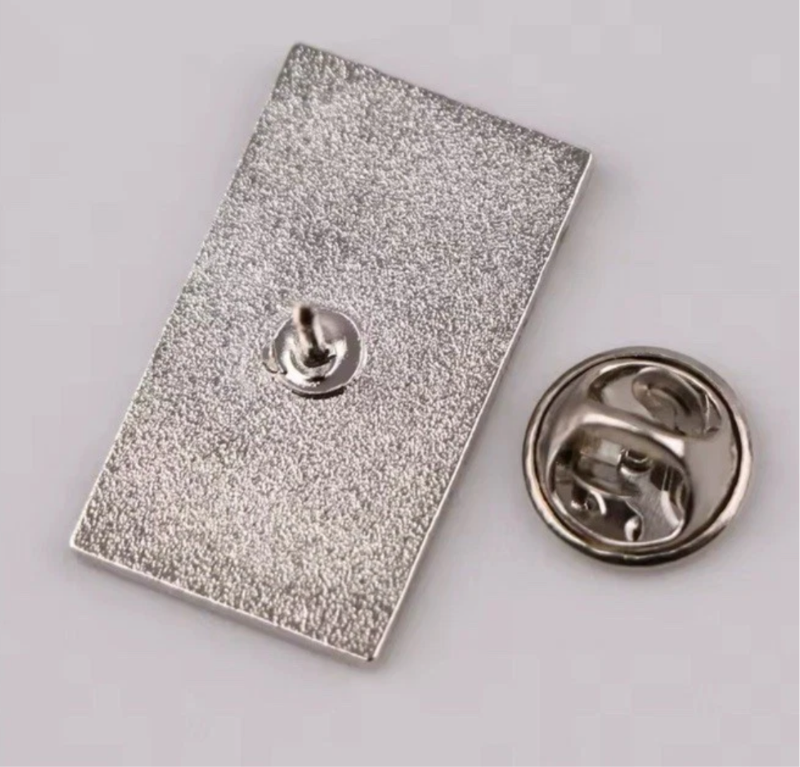 Back view of metal base and clasp of I'm not weird lapel pin from Reed’s Rubber Ducks and Sensory Shop