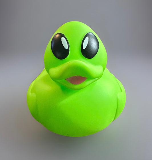 Neon green alien rubber duck with large black eyes from Reed’s Rubber Ducks and Sensory Shop