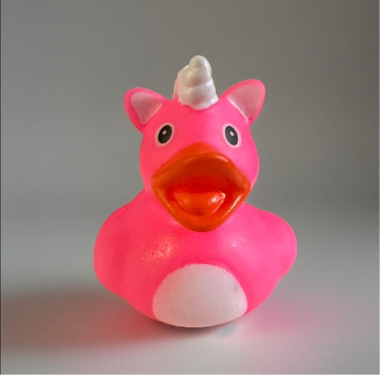 Pink unicorn rubber duck with white horn and orange beak from Reed’s Rubber Ducks and Sensory Shop
