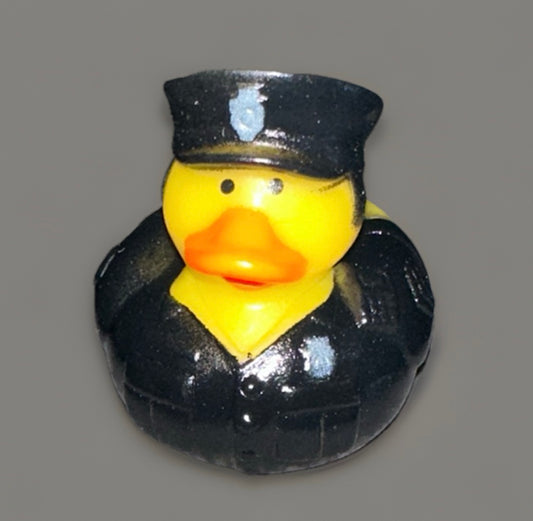 Yellow police rubber duck wearing a black police uniform and hat with badge details
