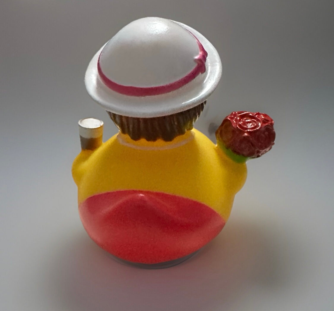 Red bouquet rubber duck gift holding a red rose and wearing a white hat with pink ribbon