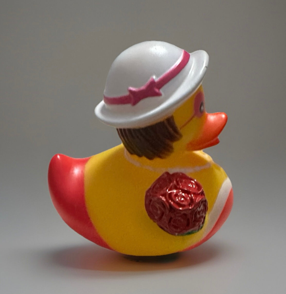 Red bouquet rubber duck gift wearing white hat and holding red rose bouquet from Reed’s Rubber Ducks
