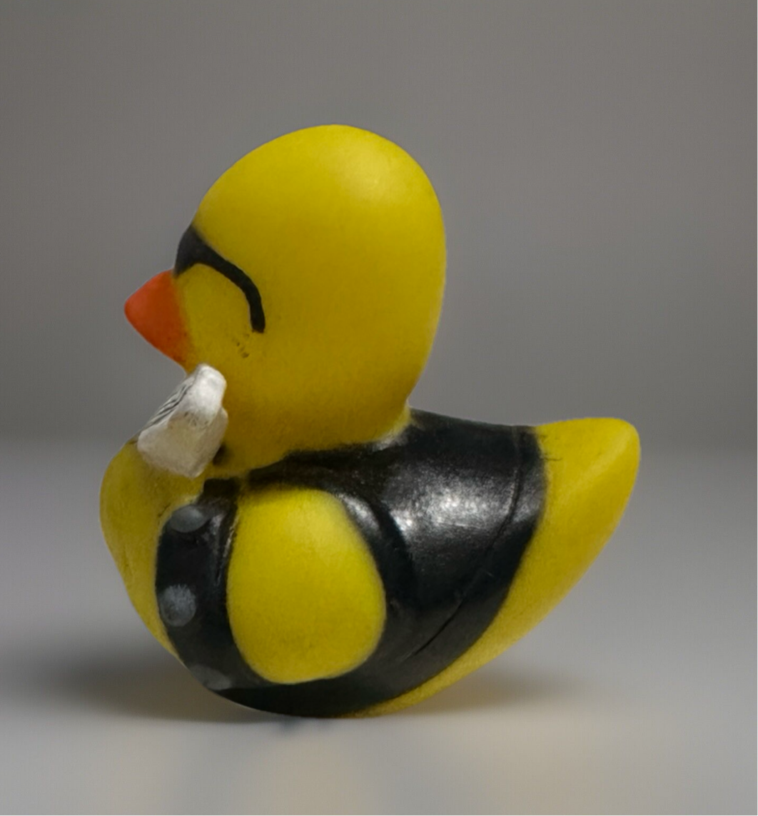 Yellow rock and roll rubber duck wearing black leather vest and sunglasses by Reed’s Rubber Ducks and Sensory Shop