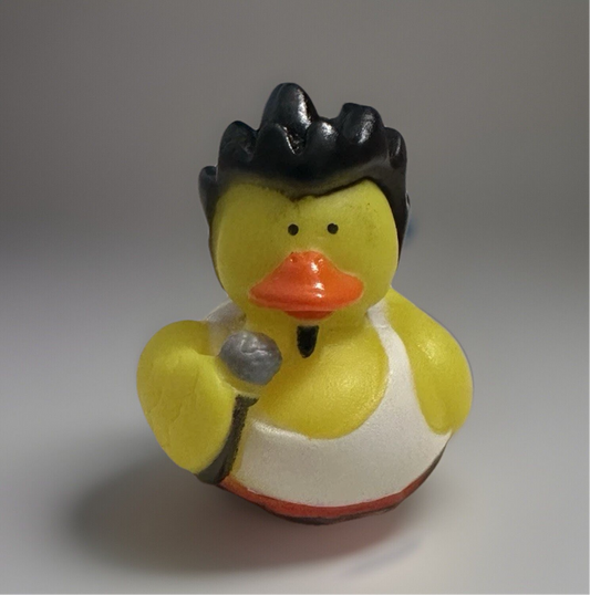 Rock and roll rubber duck toy with black hair, white tank top, and microphone from Reed’s Rubber Ducks