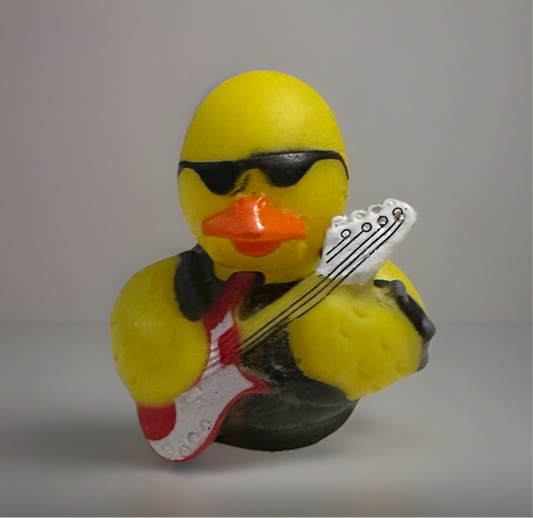 Rock and roll rubber duck wearing sunglasses and holding a red and white electric guitar