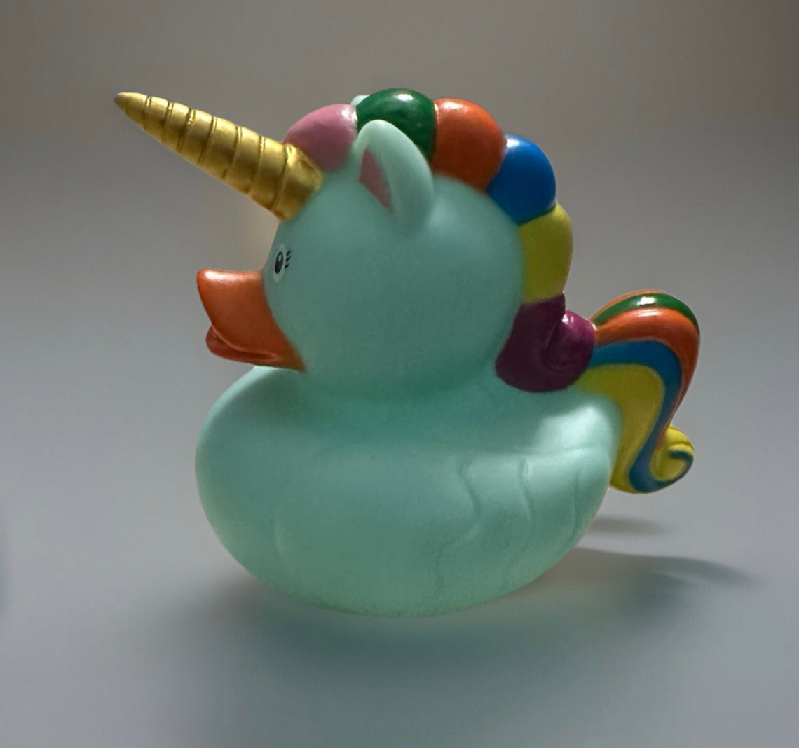 Sea foam unicorn rubber duck with gold horn and colorful rainbow mane from Reed's Rubber Ducks and Sensory Shop