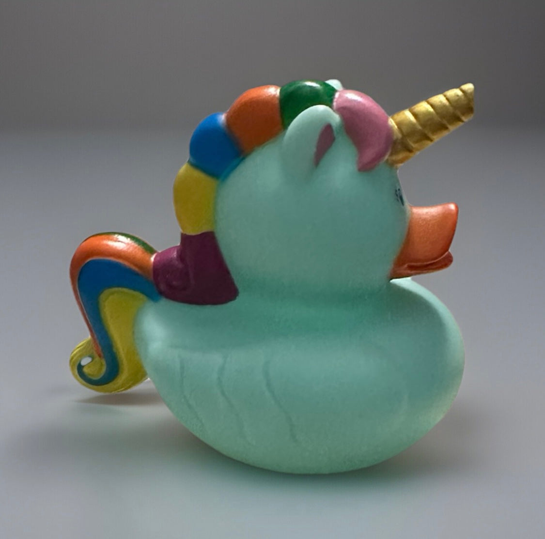 Sea foam unicorn rubber duck with rainbow mane and golden horn from Reed’s Rubber Ducks and Sensory Shop
