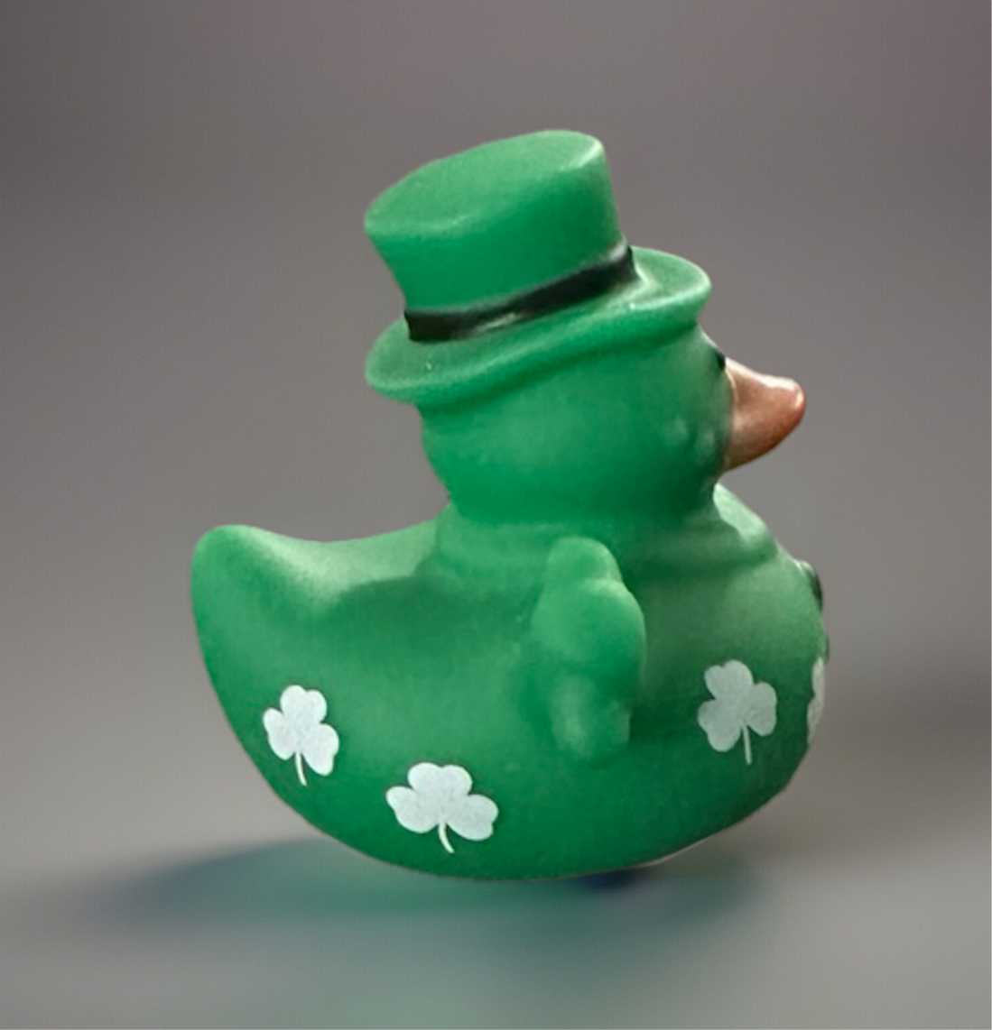 Bright green St. Patrick’s Day rubber duck wearing a top hat and decorated with shamrock designs