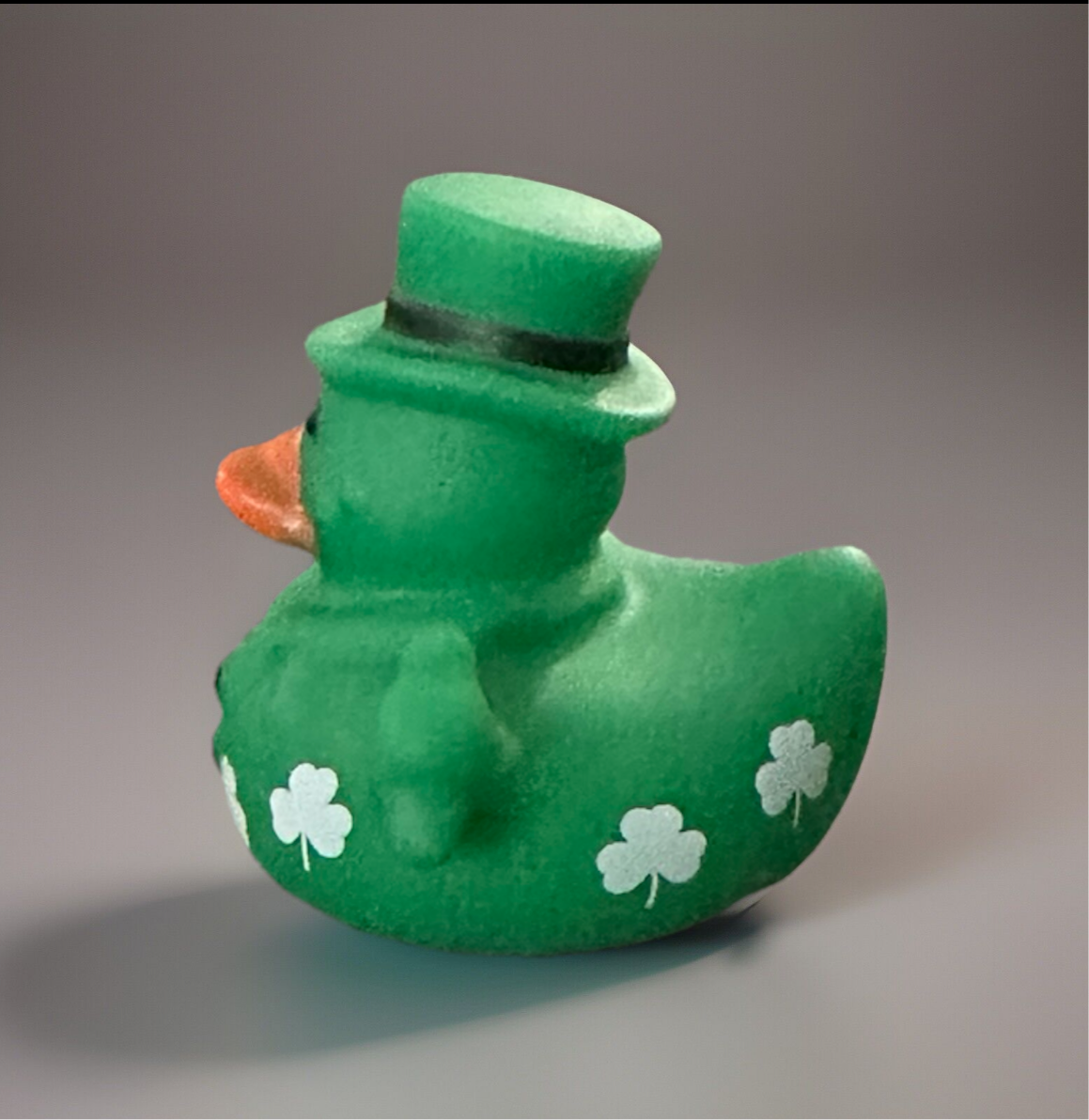 Festive green St. Patrick’s Day rubber duck with shamrock designs and a top hat