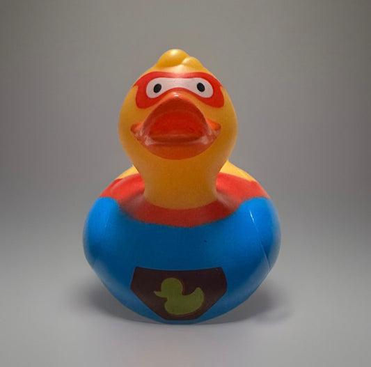 Super hero rubber duck in blue costume with red mask and yellow beak from Reeds Rubber Ducks and Sensory Shop