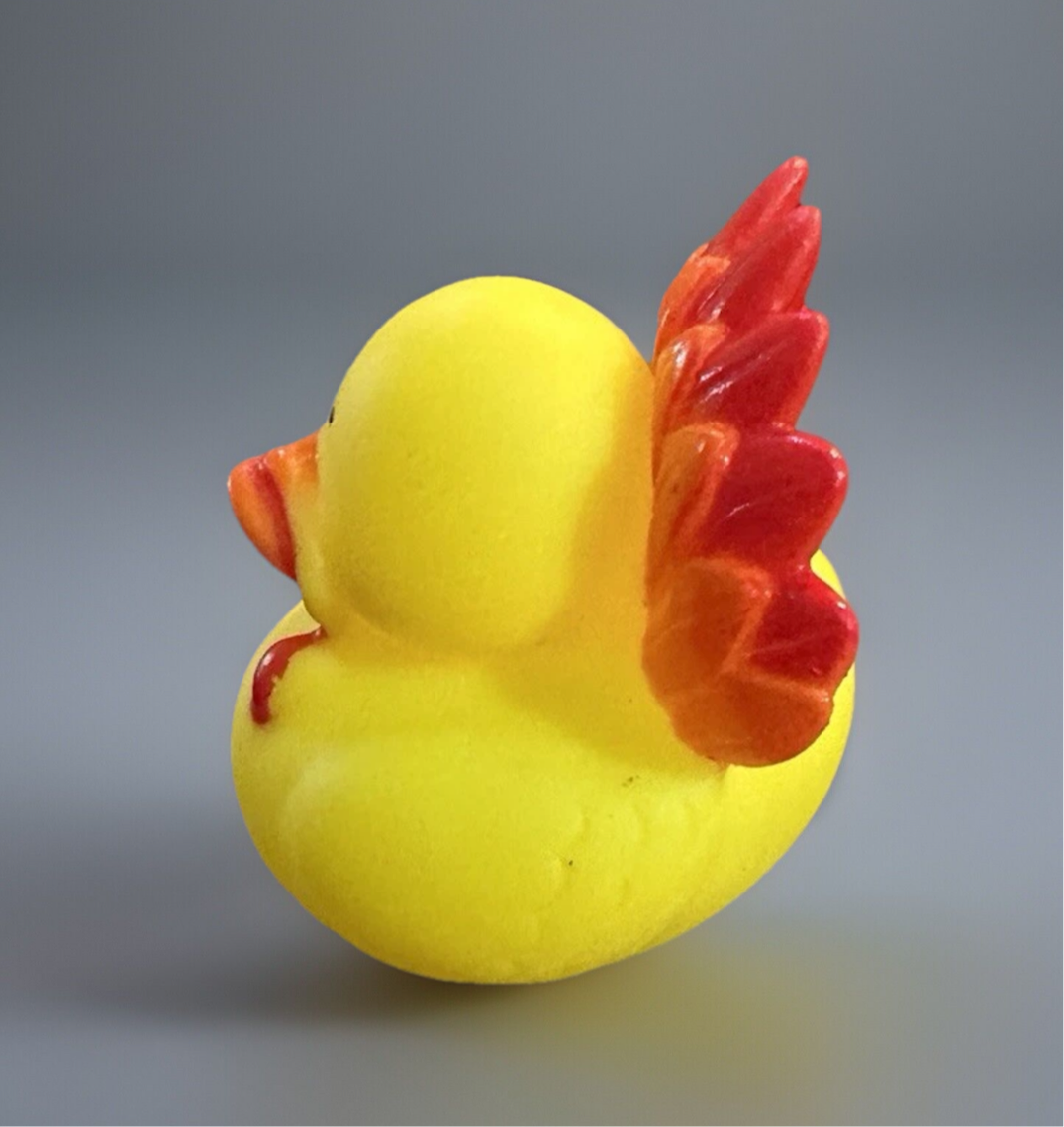 Thanksgiving turkey rubber duck with bright yellow body and colorful feathered wings