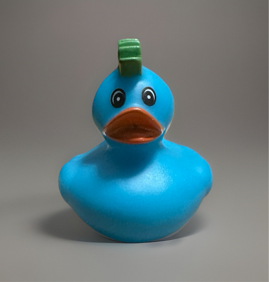 Cute turquoise rubber duck gift with a green tuft, perfect for fun and sensory play