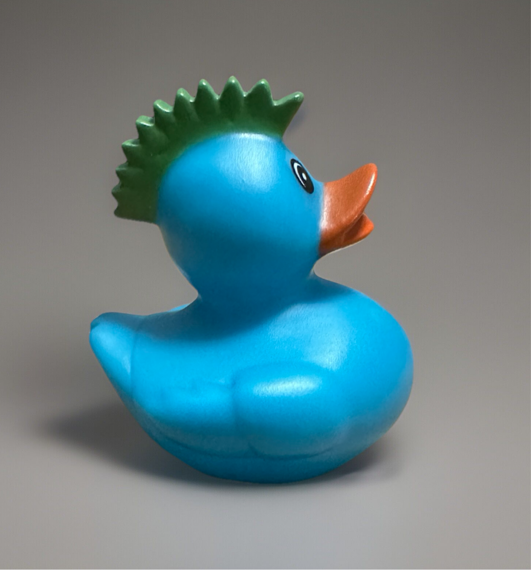 Adorable turquoise rubber duck gift with a green mohawk, perfect for kids and decoration