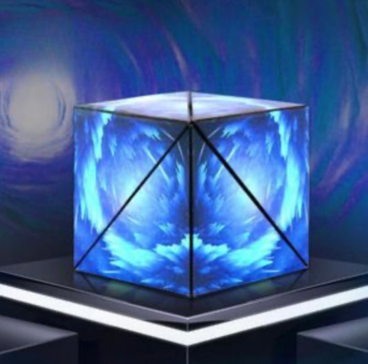 Interactive 3D puzzle cube with glowing blue geometric patterns displayed on a black pedestal
