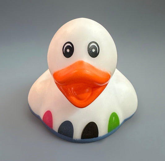 White Easter rubber duck with orange beak and colorful spots from Reed’s Rubber Ducks and Sensory Shop